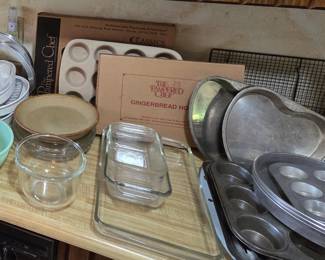 Pampered chef Gingerbread House mold (never used, in original box), Pampered chef muffin pan (never used, in original box), pie tins, baking dishes, etc.