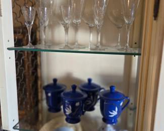 Set of etched barware glasses  $15                                                       Set of 4 Blue lidded Ceramic cups                