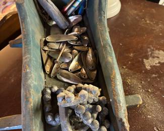 antique cradle and some fishing lures