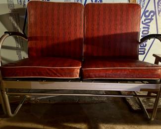 Also, in the lower level - this beautiful vinyl glider and accompanying chair are waiting for you