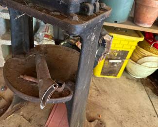 some odd cast iron antique type of juicer?apple press? solid cast iron with metal bowl 
