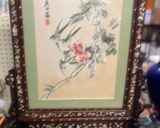 Spectacular Oriental Hand Made silk screen mounted in an ornate 2 piece wooden frame. The frame is trimmed with a large amount of MOTHER OF PEARL INLAY!