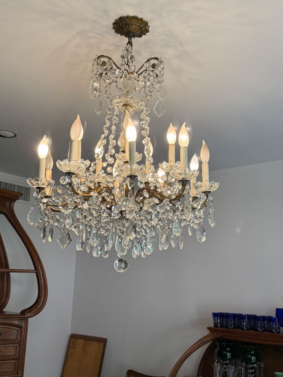 The largest of the crystal chandeliers in the home….