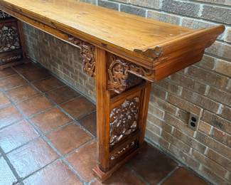 This beautiful entry table hand carved