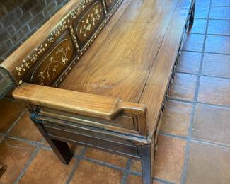 Inlayed carved bench