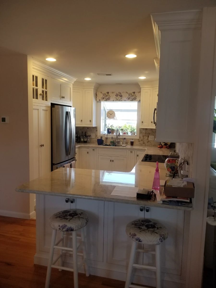 Amish-built U-shaped kitchen with custom cabinetry