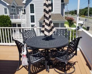 Cast aluminum patio dining set with umbrella seats 4