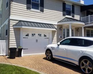 Garage door; hardscape driveway pavers