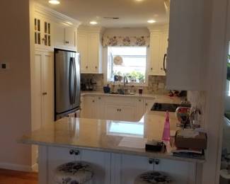 Amish-built U-shaped kitchen with custom cabinetry