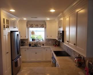Amish-built U-shaped kitchen with custom cabinetry