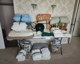 Linens including afghans, quilts, and bedding