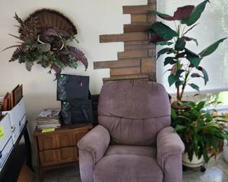 Recliner, variety of living and silk plants