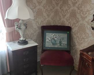 Awesome porcelain lamps, painting in chair is an original by home owner