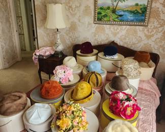 Collection of vintage hats, painting on wall is an original by home owner