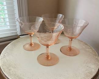 R114 - $20. Set of 4 Pink Depression Glasses. 1 has minor chip.