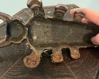 R54 - $25. Vintage Cast Iron Boot Jack Beetle.
