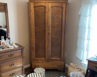 R142 - $125. Cute Antique Armoire with shelves inside for storage.