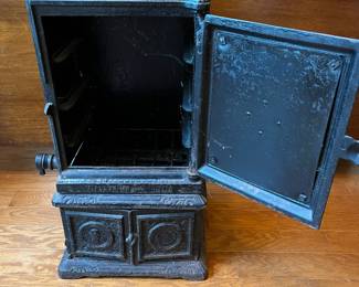 R91 - $60. Small Cast Iron Stove. Measures 12" square x 22" tall.