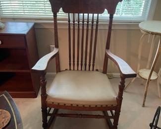 R117 - $75. Antique Solid Wood Rocking Chair.