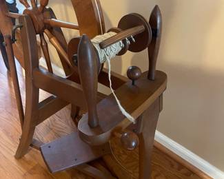 R127 - $100 Small Wooden Spinning Wheel. Includes what is in photograph.