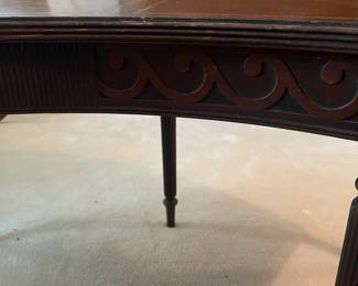 R118 - $50. Mahogany Rounded Coffee Table with leather top. Measures 4'wide x 14"deep x 16.5"tall. Drop sides are 11.25" each