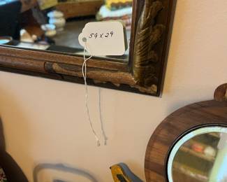 R83 - $125. Antique Mirror measures 59" x 29" tall. Overall good condition - has one minor decorative wooden piece missing.