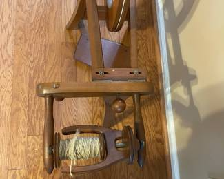 R127 - $100 Small Wooden Spinning Wheel. Includes what is in photograph.