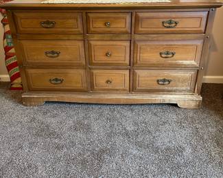 R143 - $50. Dresser with mirror. Drawers all slide but it does have surface damage.