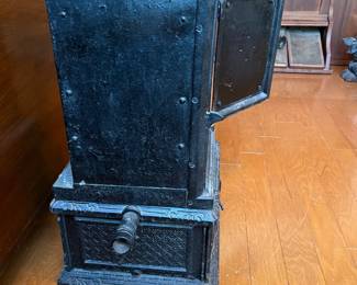R91 - $60. Small Cast Iron Stove. Measures 12" square x 22" tall.