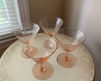 R114 - $20. Set of 4 Pink Depression Glasses. 1 has minor chip.