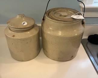 R56 - $20 Crock on Left. $50 - Lidded/Handled Crock on Right.