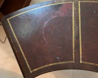 R118 - $50. Mahogany Rounded Coffee Table with leather top. Measures 4'wide x 14"deep x 16.5"tall. Drop sides are 11.25" each