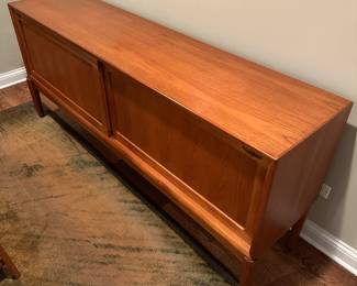 1970's Modernist Teak Sideboard on Base with Sliding Doors. Measures 31"H x 75"L x 18"D. Image 5. Price $850