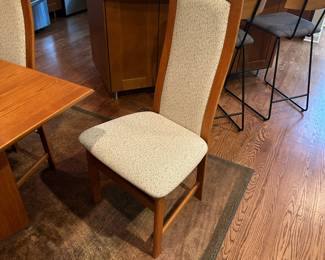 1970's Modernist Teak Dining Room Table with 6 Chairs. Includes extra leaf (not shown). Measurements as shown: 31"H x 38"W x 70"L. Chairs measure 42" tall to the top of the back x 19"W at widest point of seat. Image 3. Table and 6 Chairs $2400.