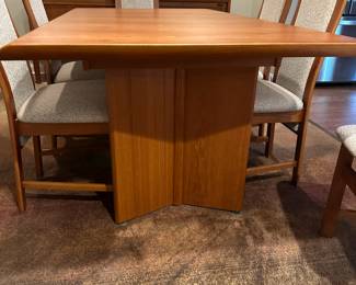 1970's Modernist Teak Dining Room Table with 6 Chairs. Includes extra leaf (not shown). Measurements as shown: 31"H x 38"W x 70"L. Chairs measure 42" tall to the top of the back x 19"W at widest point of seat. Image 2. Table and 6 Chairs $2400.
