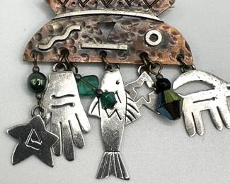 Artisan jewelry pin of copper and sterling silver