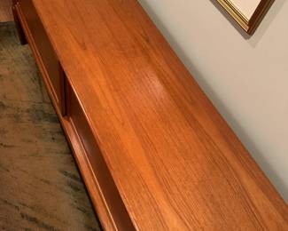 1970's Modernist Teak Sideboard on Base with Sliding Doors. Measures 31"H x 75"L x 18"D. Image 6. Price $850