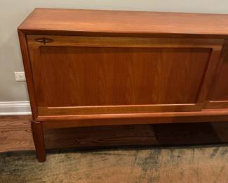 1970's Modernist Teak Sideboard on Base with Sliding Doors. Measures 31"H x 75"L x 18"D. Image 2. Price $850