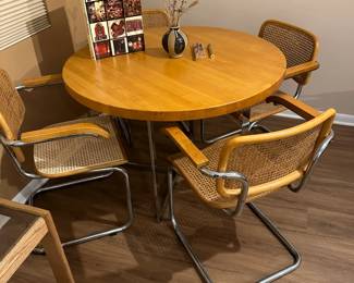 Mid century chrome and wood dinette set with cane seating.