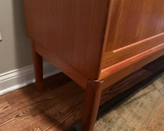 1970's Modernist Teak Sideboard on Base with Sliding Doors. Measures 31"H x 75"L x 18"D. Image 4. Price $850