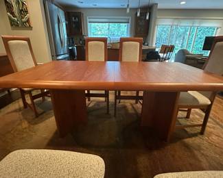 1970's Modernist Teak Dining Room Table with 6 Chairs. Includes extra leaf (not shown). Measurements as shown: 31"H x 38"W x 70"L. Chairs measure 42" tall to the top of the back x 19"W at widest point of seat. Image 10. Table and 6 Chairs $2400.