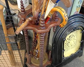 cane and walking stick collection in a awesome antique umbrella stand 
