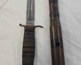 fixed blade and a 20mm decommissioned bullet 