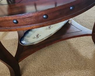 Rustic , Wood round coffee table with bottom shelf , great condition.
