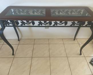 Glass & wood Top of this Sofa Table with leaves & grapes in metal. 