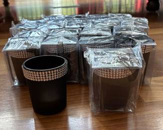 New, 24 black and silver votives with candles. Individually wrapped with gift note. Great for party give away.
