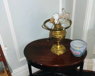 2 round tables and 2 old oil lamps converted to electric