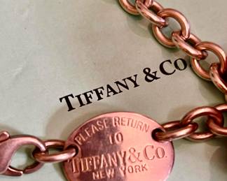 Fine and costume jewelry. Removed daily. Tiffany & Co sterling roll necklace. 