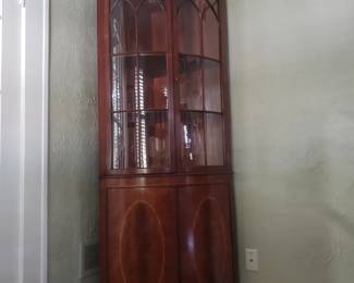 ARTHUR BRETT, GEORGE III STYLE, CROTCH MAHAGONY CURVED CORNER CHINA CABINET