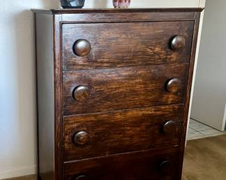 Brown four-drawer dresser